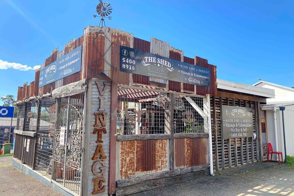 a building that is boarded up with signs on it
