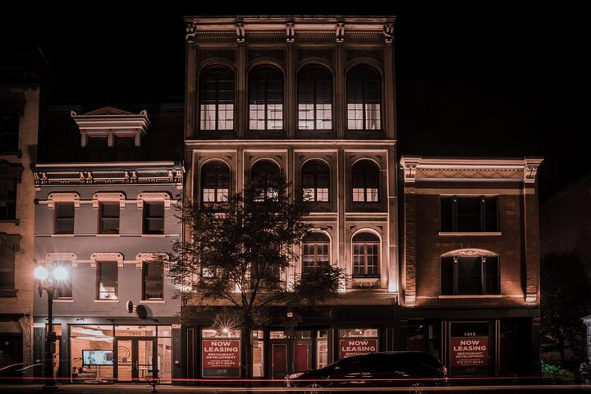 a large building with lights on the side of it