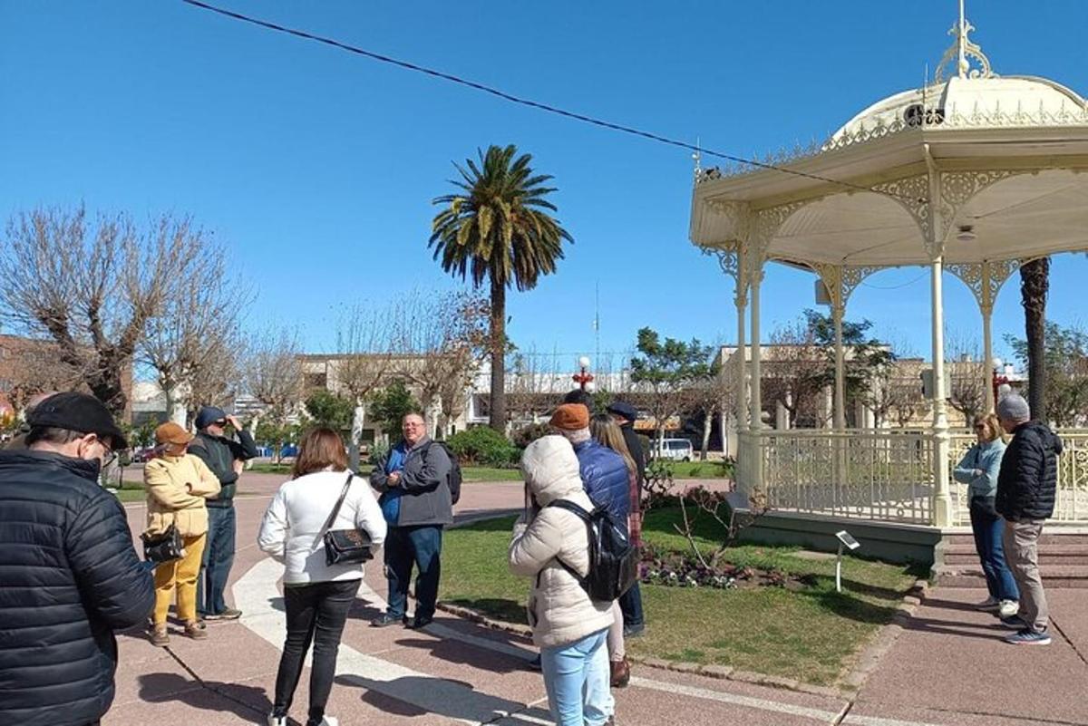 a group of people standing around a gazebo