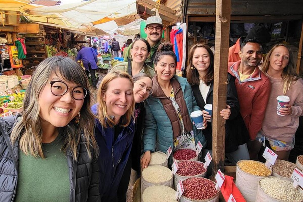 a group of people posing for a picture at a market