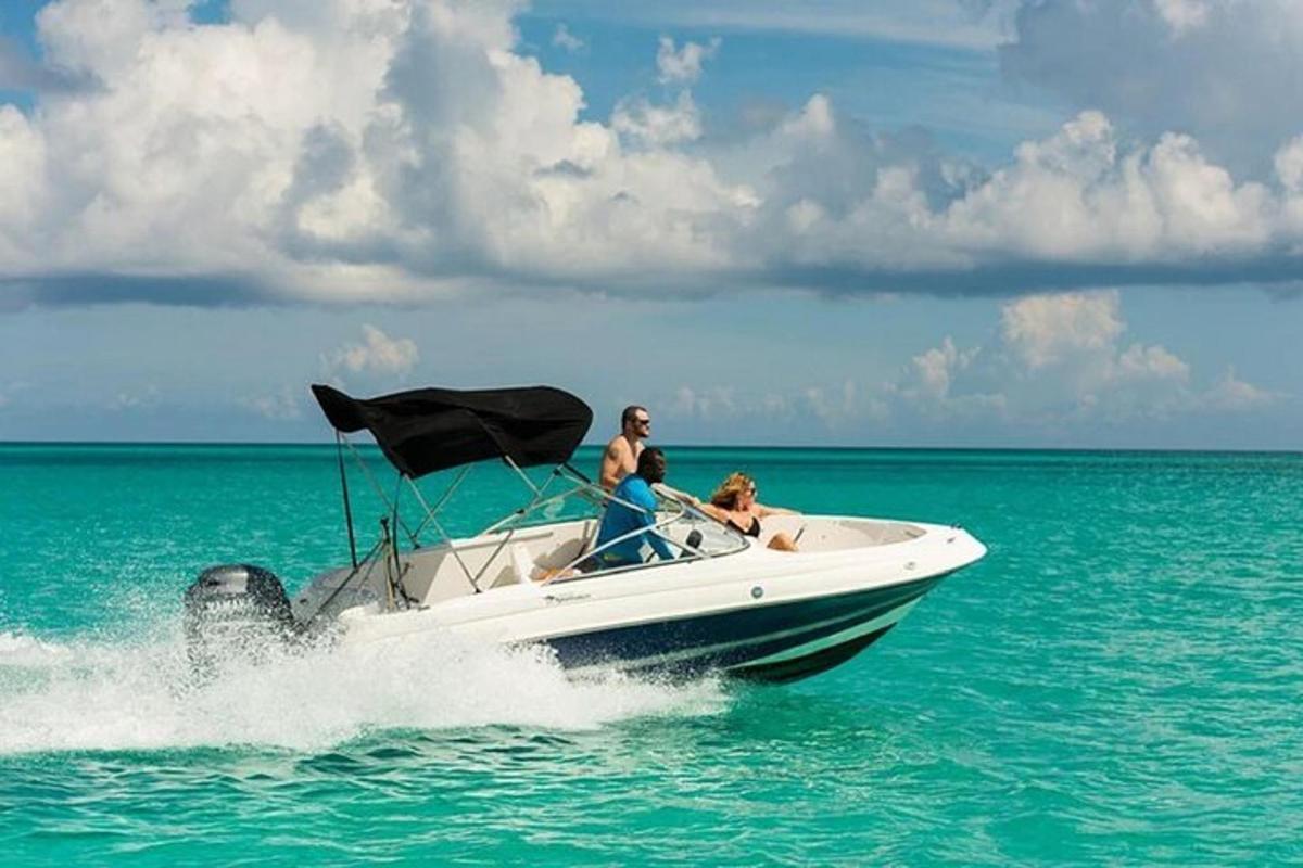 a man and a dog on a boat in the water