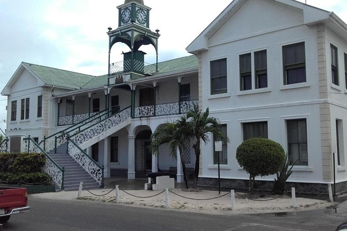 a white building with a clock tower on top of it