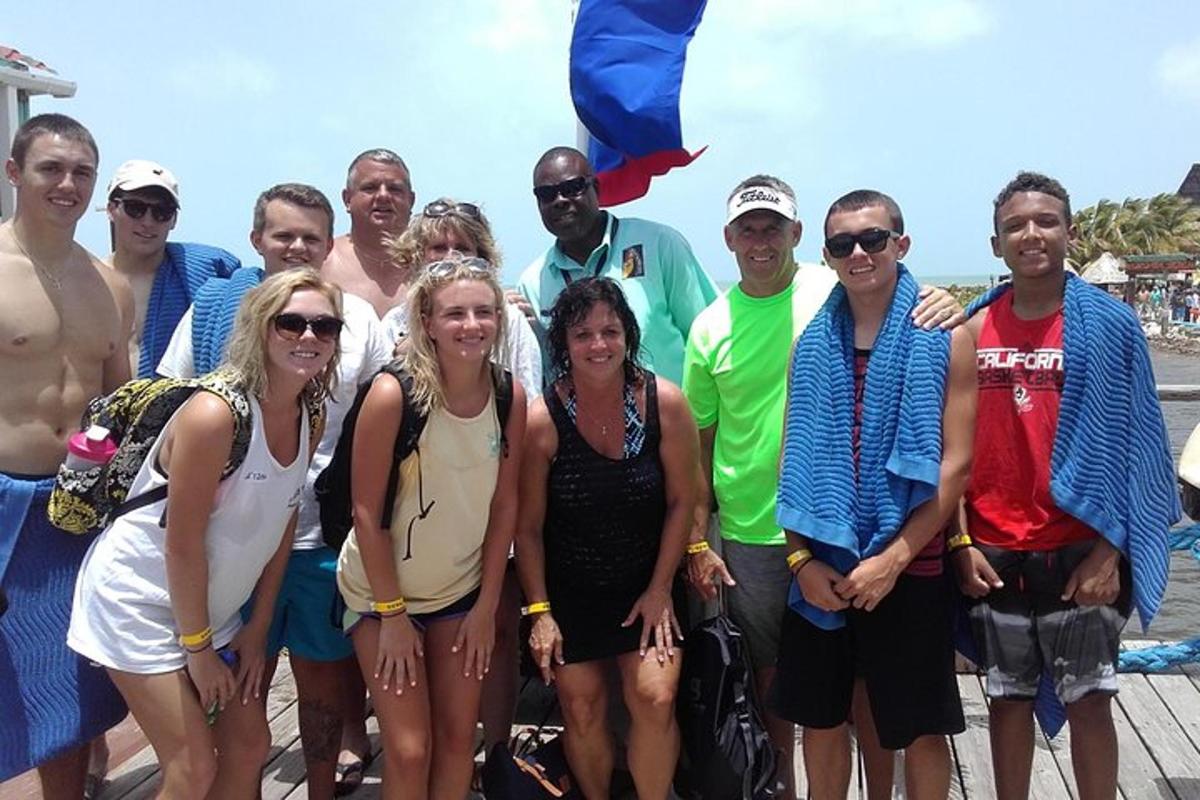 a group of people posing for a picture on a boat