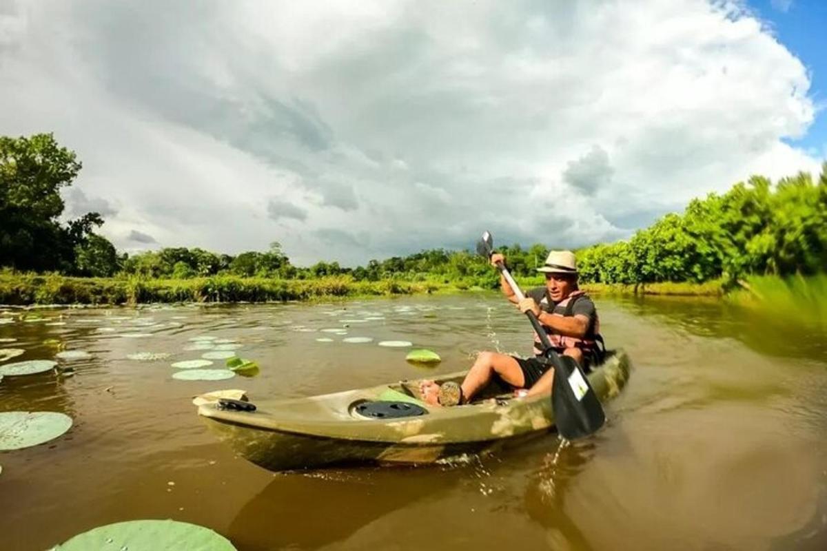 a man is rowing a boat on a river