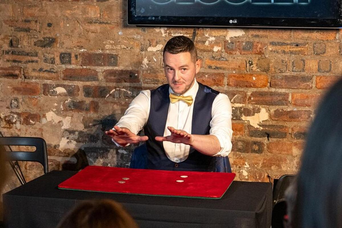 a man standing in front of a table with a red laptop