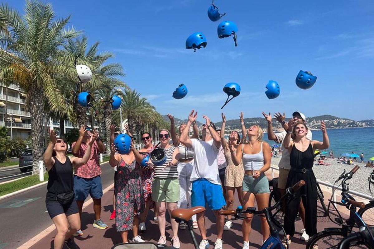 a group of people throwing their helmets in the air