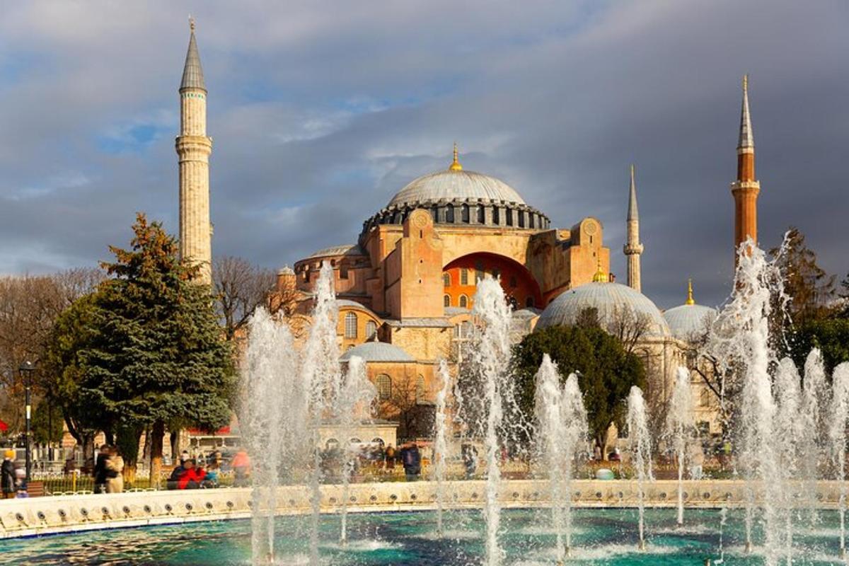 a building with domes and fountains in front of a fountain
