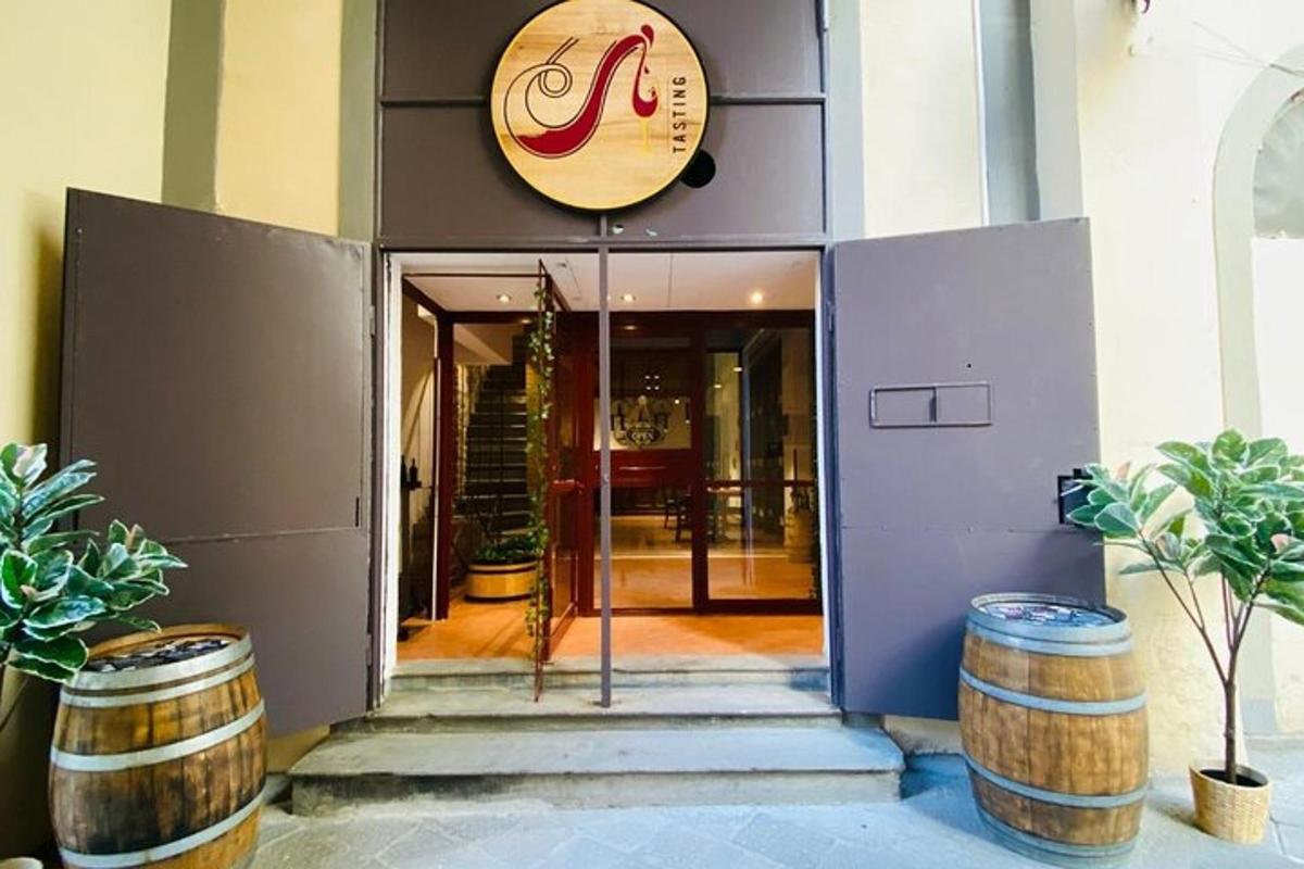a entrance to a building with barrels in front of it