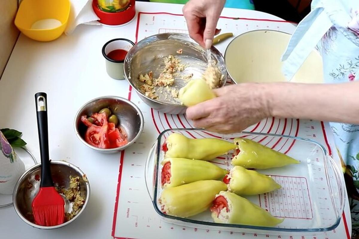 a person cutting up fruit on a table