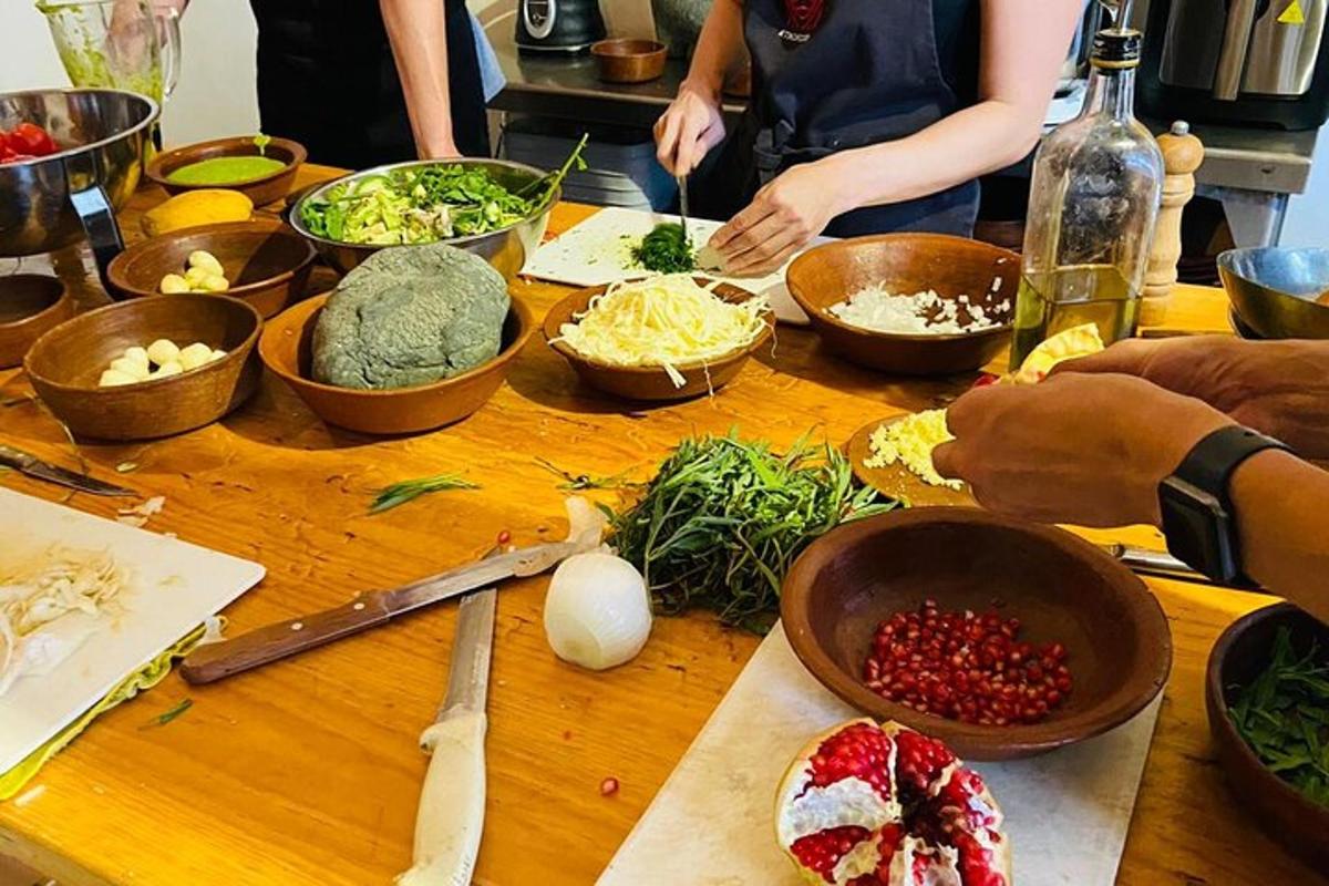 a group of people preparing food on a wooden table