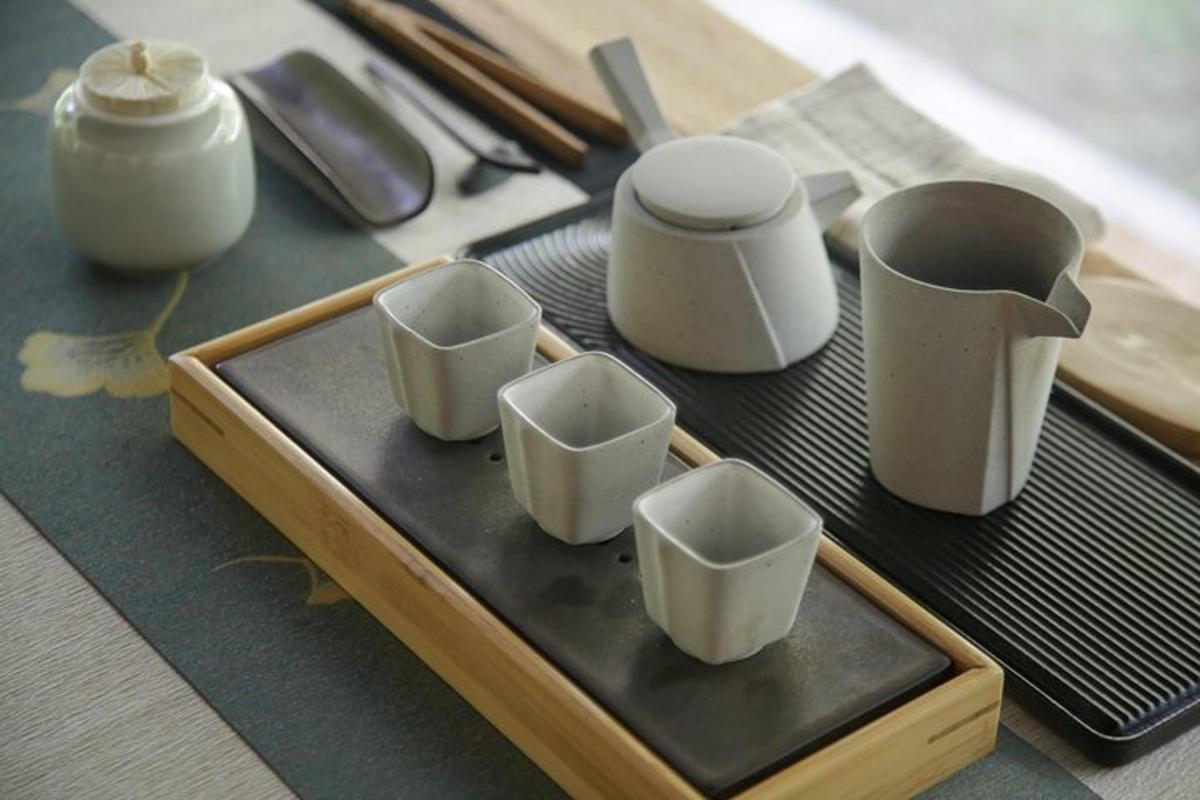 a tray with four small cups on a table