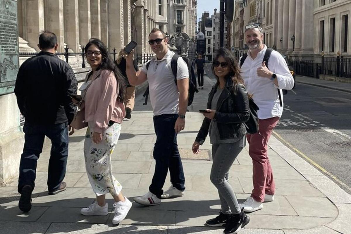 a group of people standing on a city street