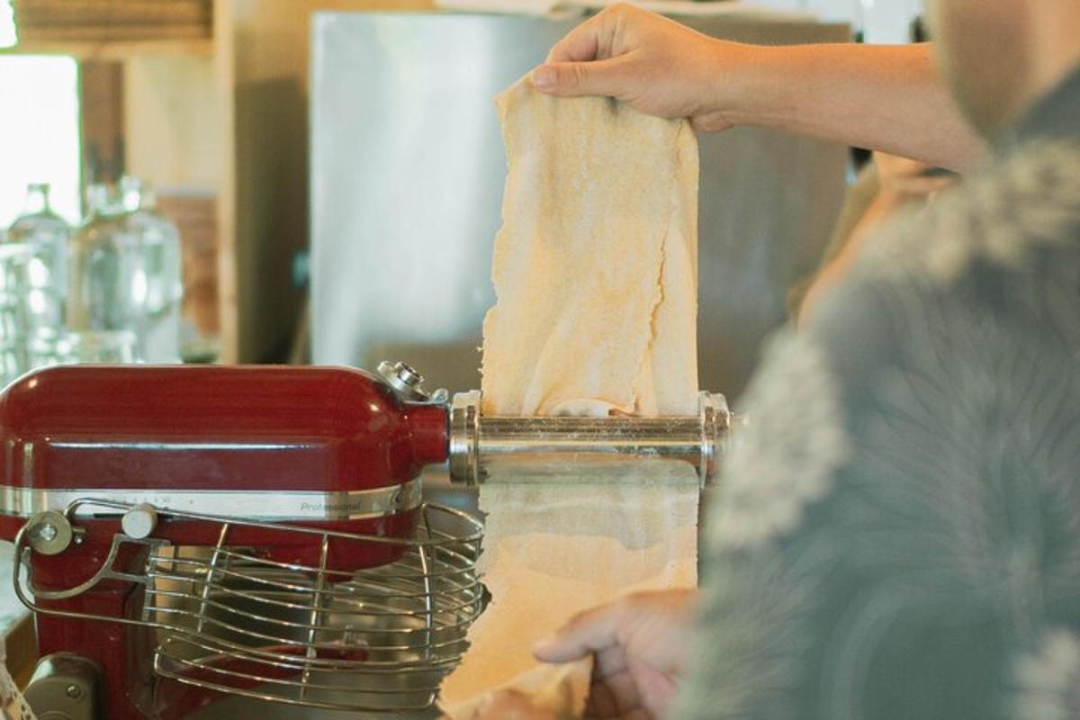 a woman is making food in a mixer