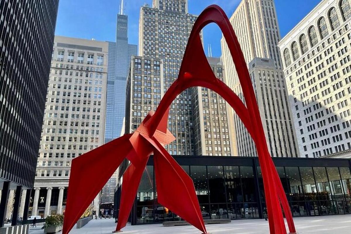 a red sculpture in the middle of a city