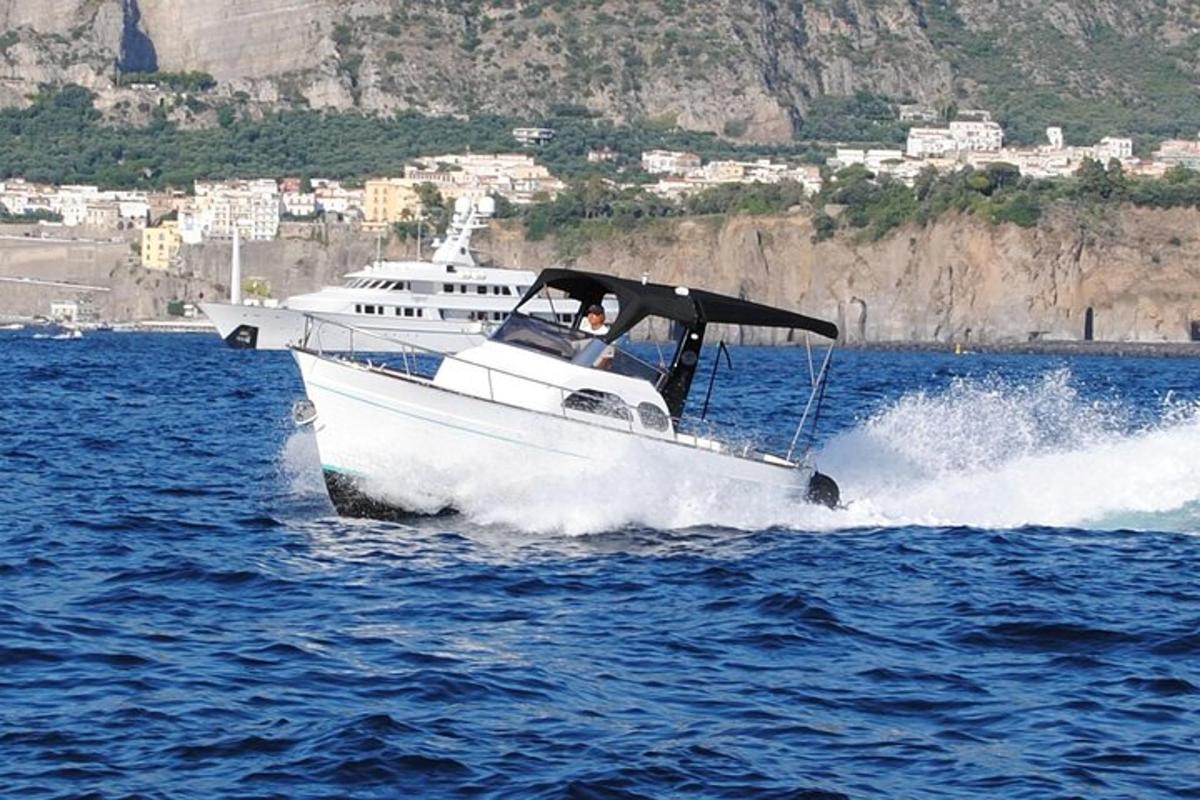a white boat in the water on the water