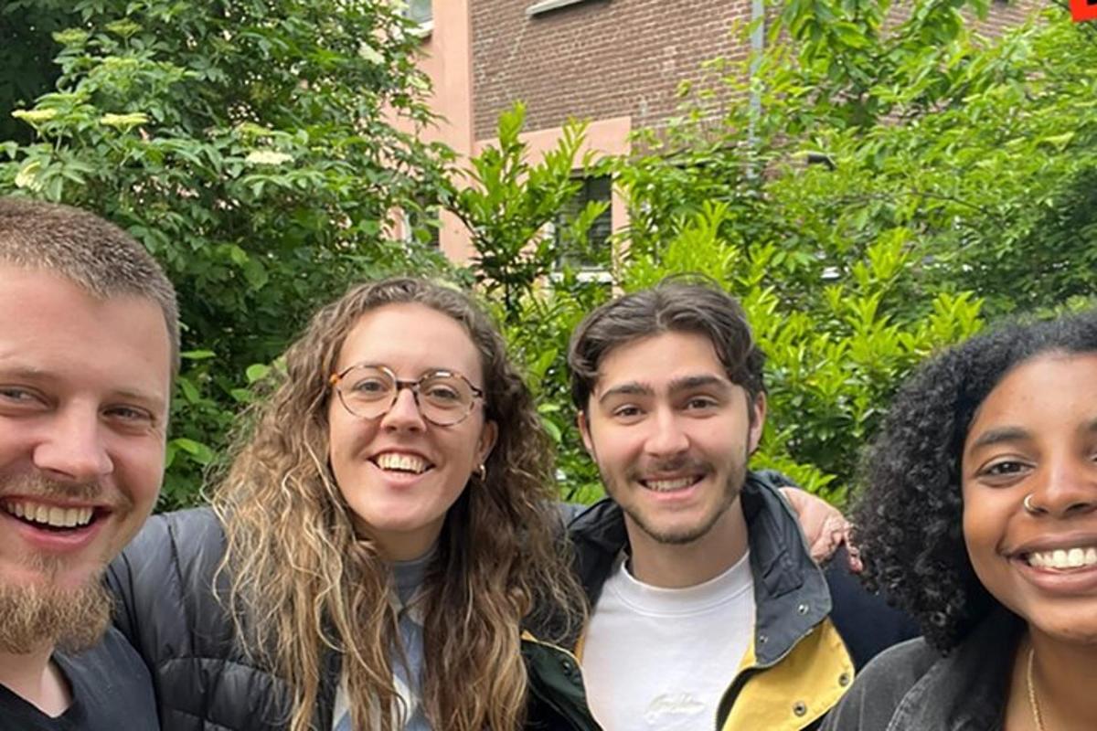 a group of four people posing for a picture