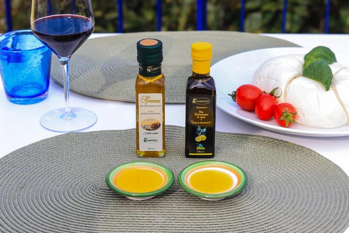 a table with two bottles of wine and a plate of food