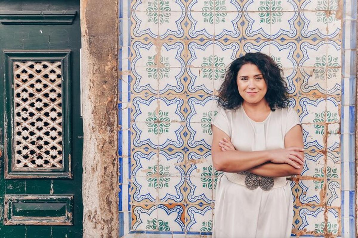 a woman standing in front of a wall