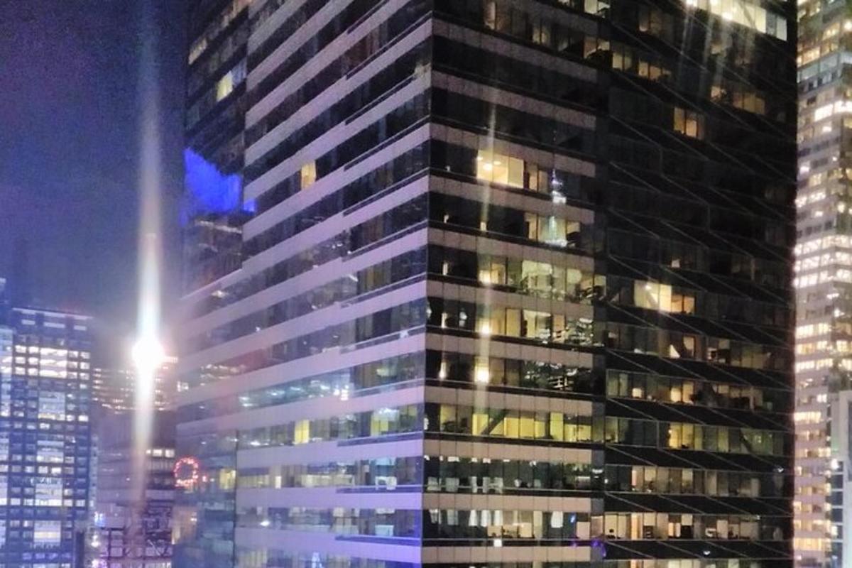 a tall building with many windows at night