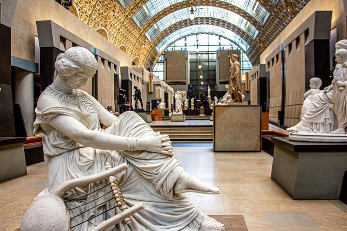 a statue of a woman sitting in a museum