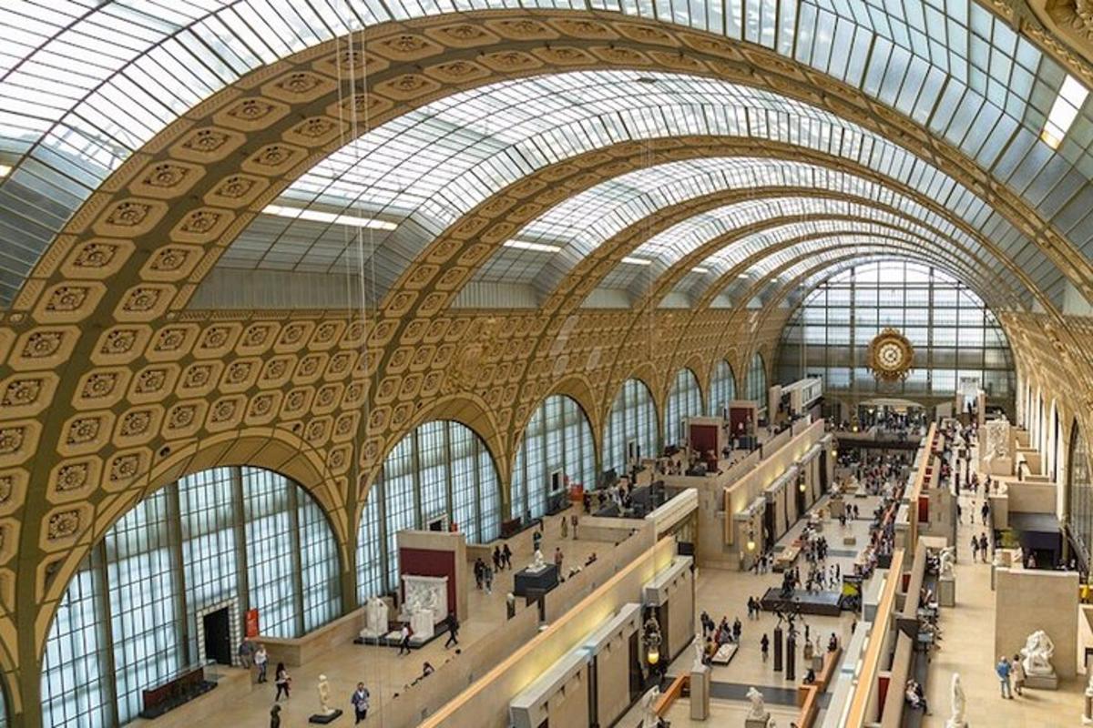 a large building with a domed ceiling with people in it