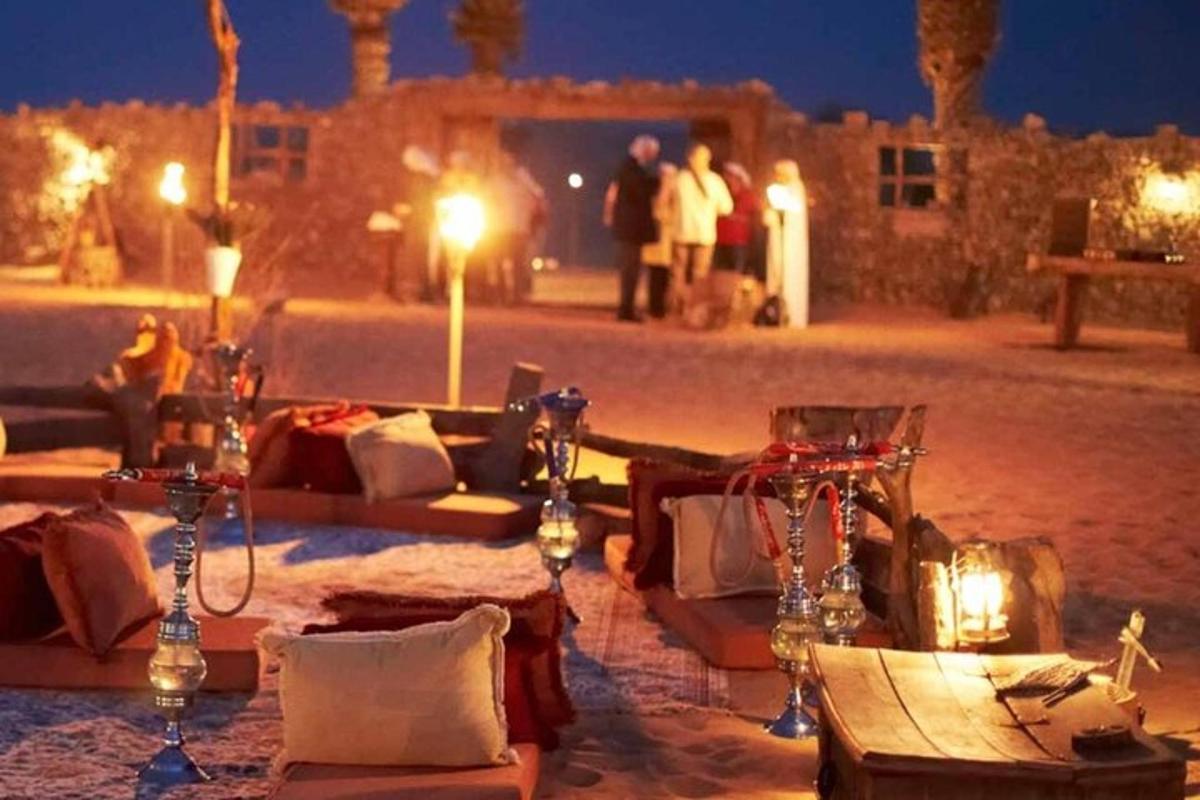 a table in the middle of a desert at night