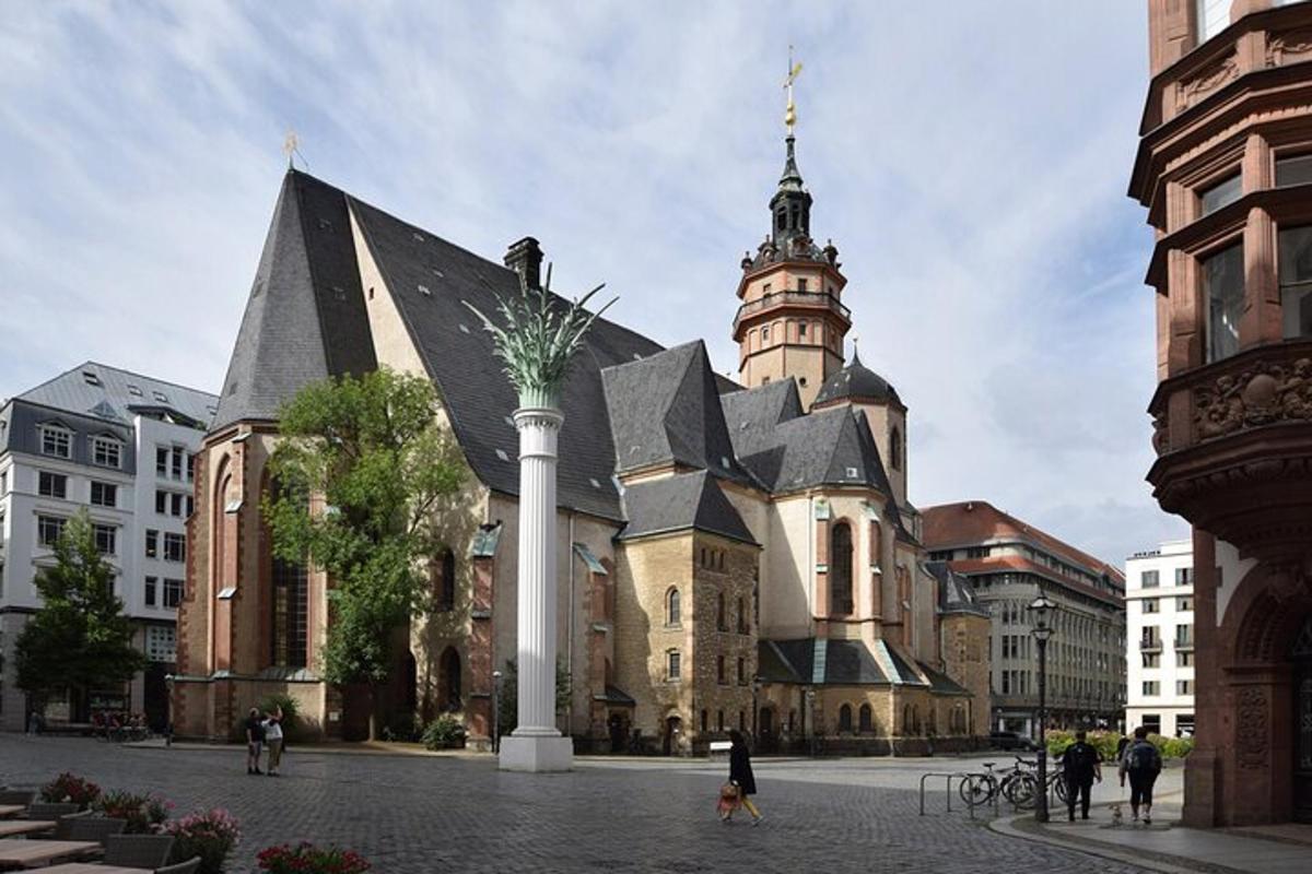 a large building with a clock tower in front of it