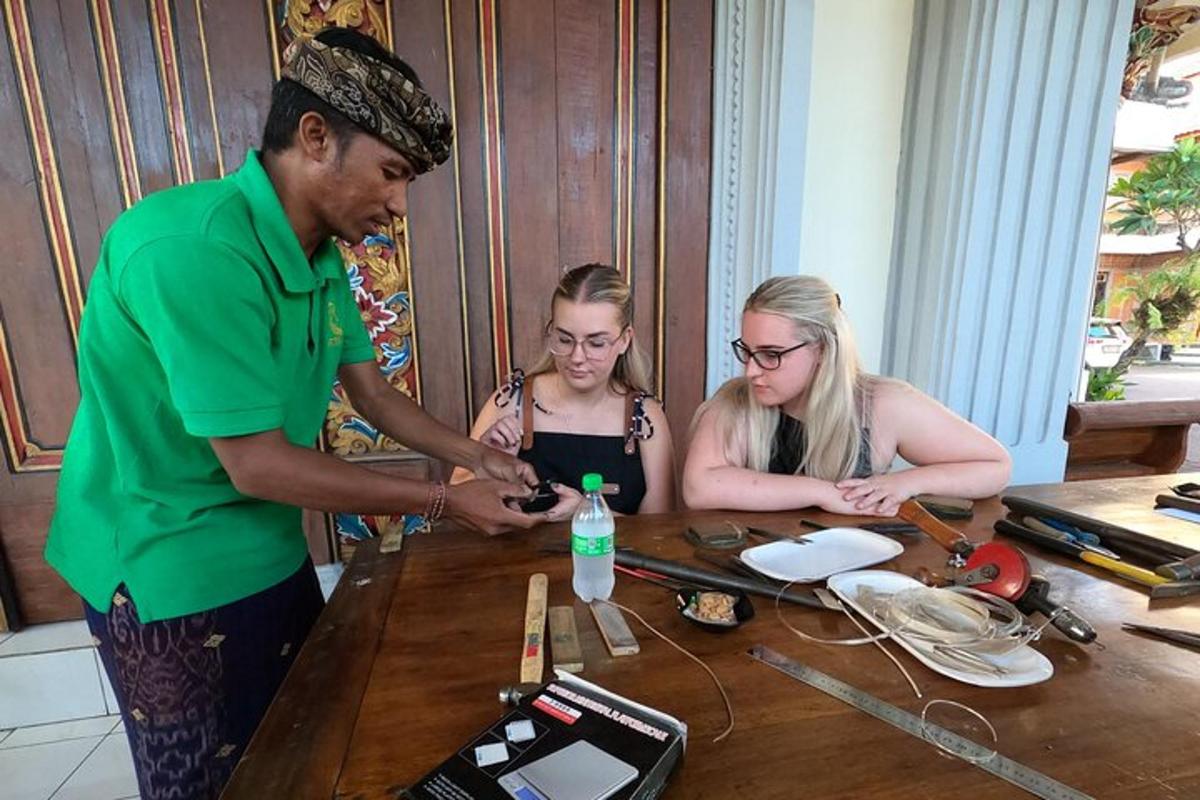 a man and two girls sitting at a table