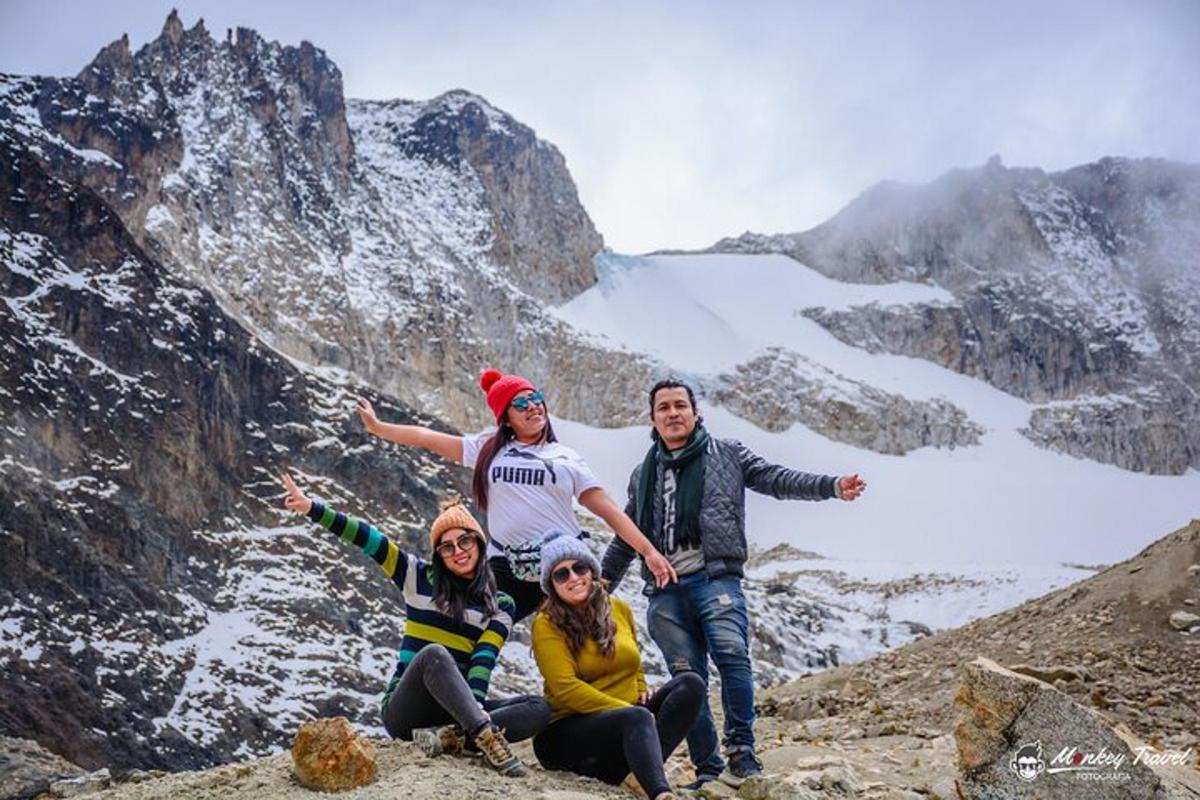 a group of people sitting on top of a mountain