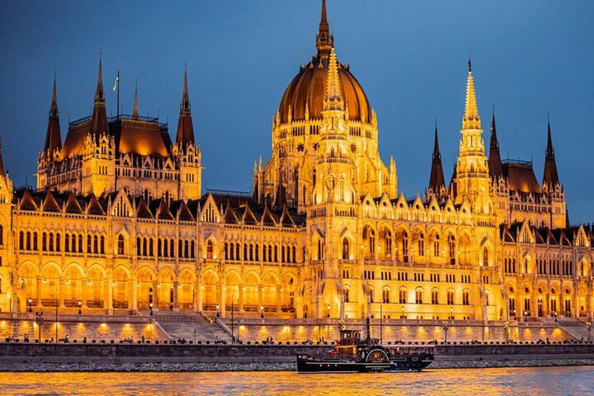 a large parliament building with a boat in front of it