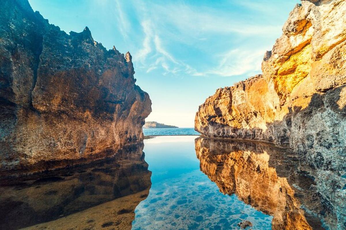 a view of a body of water between two rocks