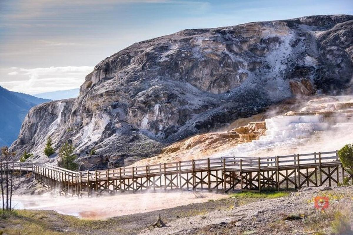 a wooden bridge on the side of a mountain