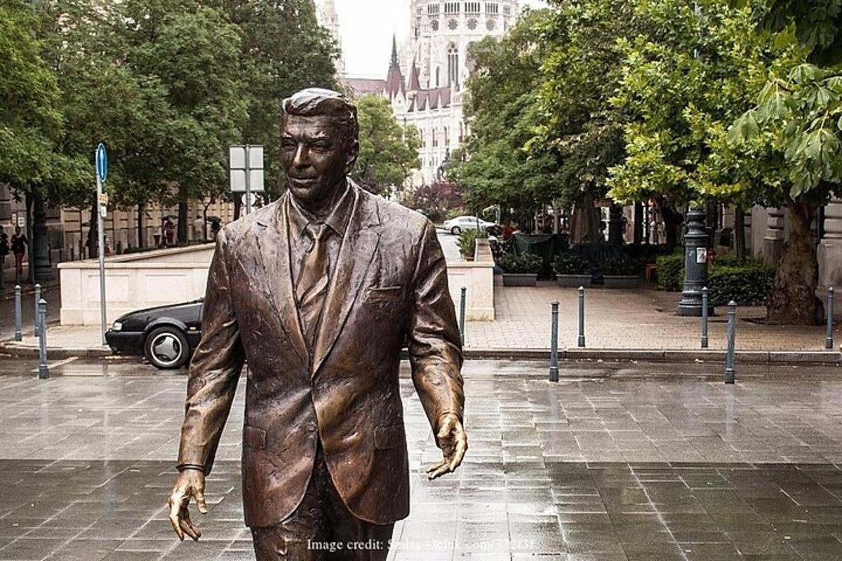 a statue of a man walking down a street