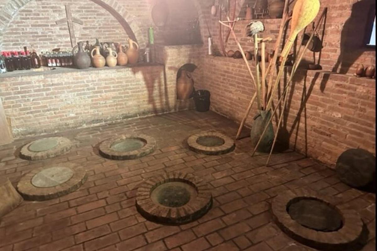 a room with a brick floor with a brick wall