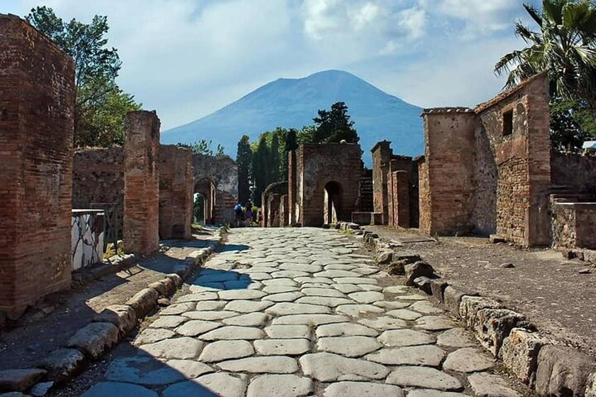 a stone street with a mountain in the background