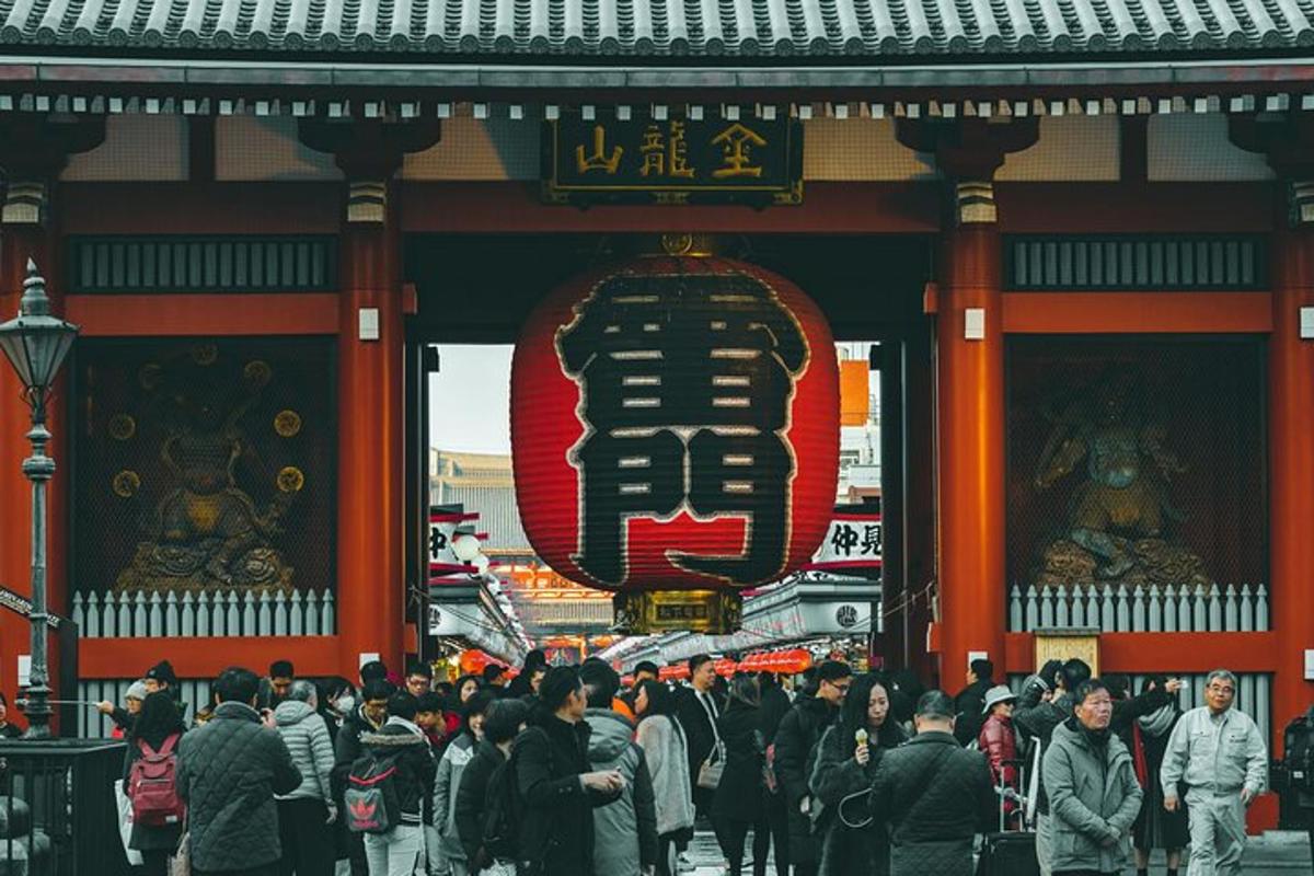 a crowd of people walking in front of a temple
