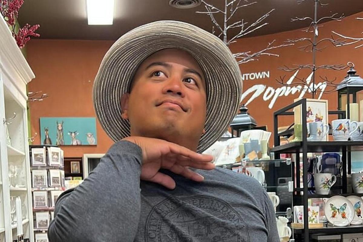 a man wearing a hat in a store