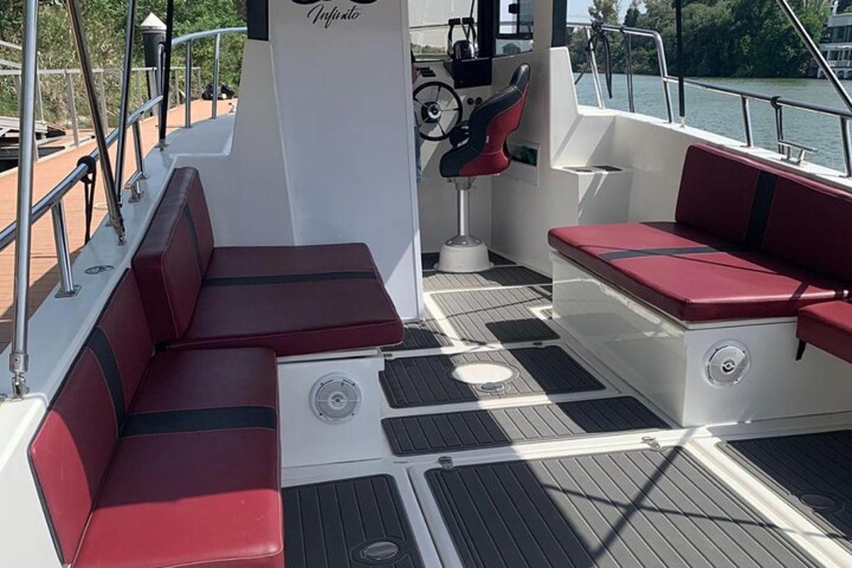 a boat with red seats on the deck of a boat
