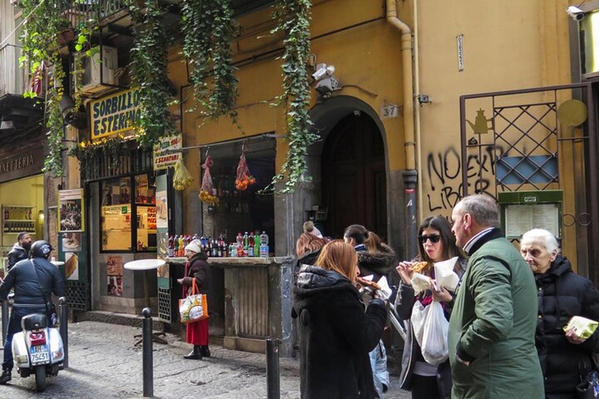 a group of people standing outside of a building