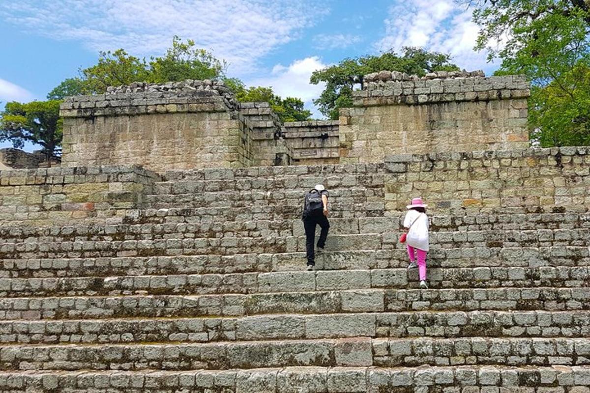 a man and a girl walking up some stairs