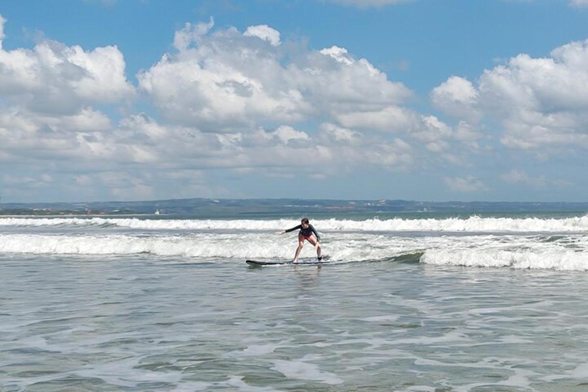 a person riding a wave on a surfboard in the ocean