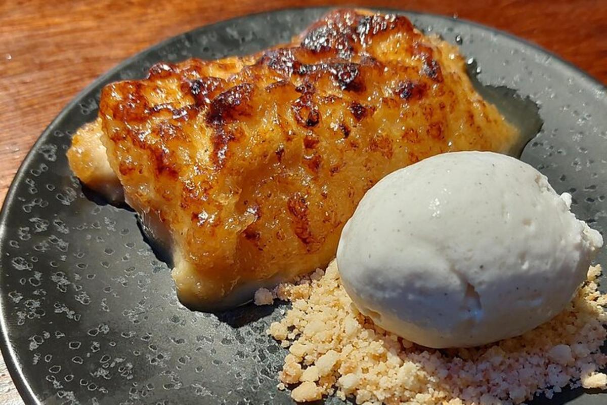 a plate of food with a piece of chicken and ice cream