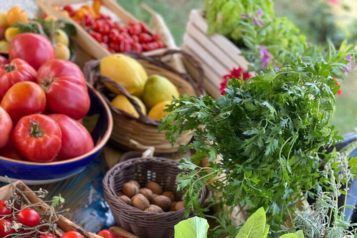 a table filled with baskets of fruits and vegetables