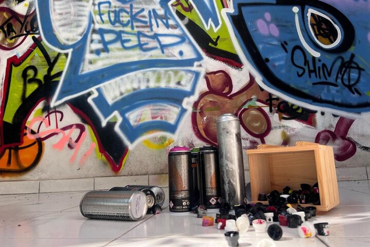 a room with graffiti on the wall and a pile of trash