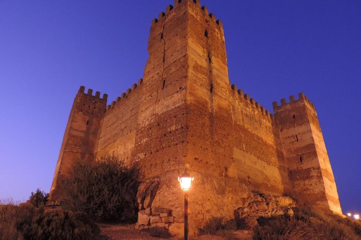 a large castle with a street light in front of it