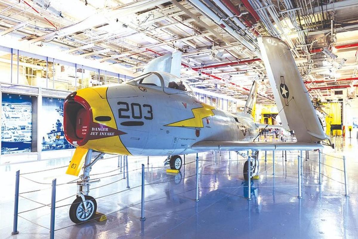 a small airplane on display in a building