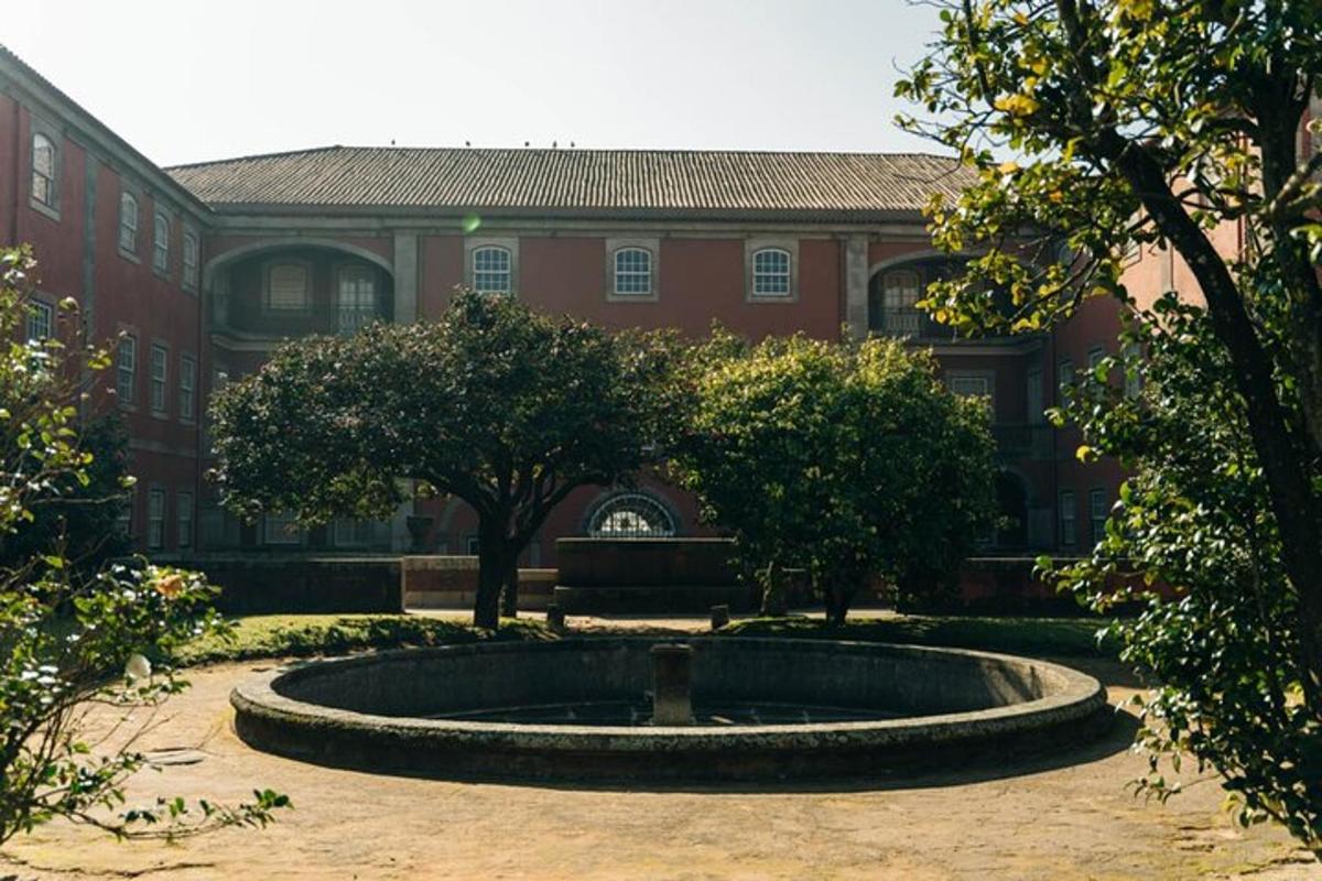 a building with a fountain in the middle of a courtyard
