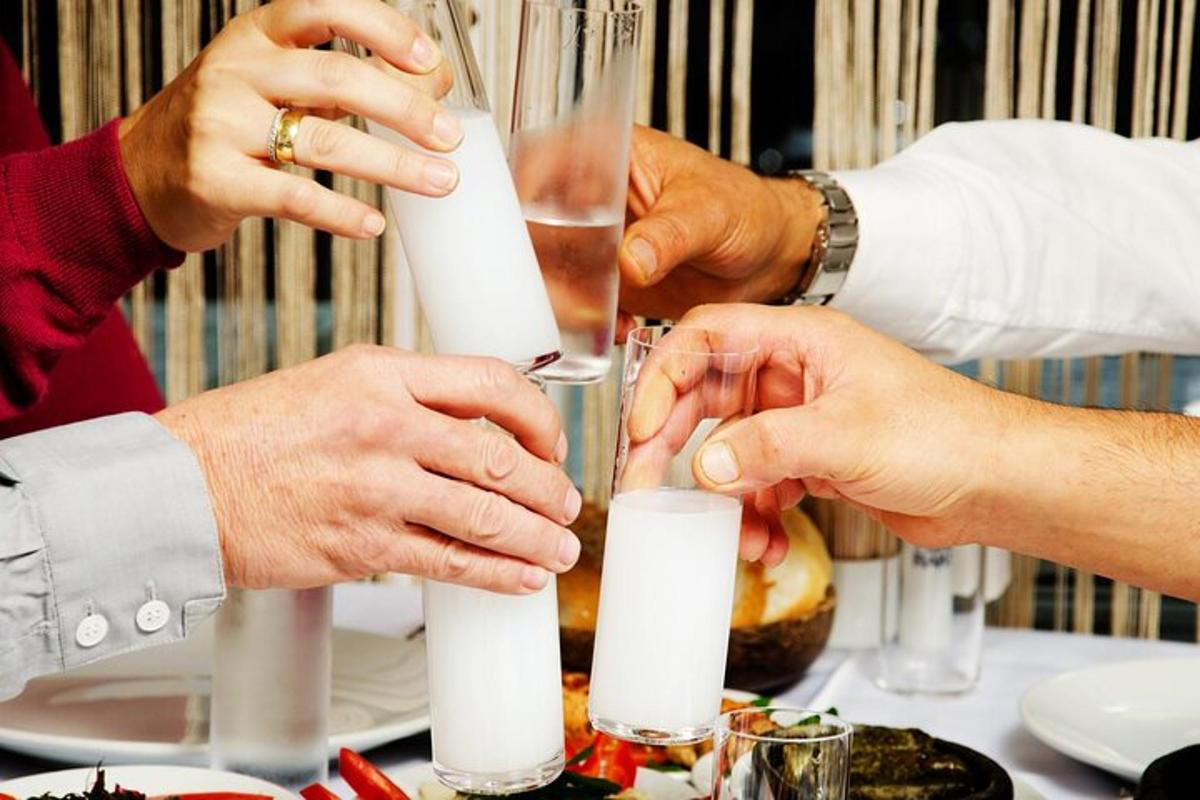 a group of people sitting at a table drinking wine