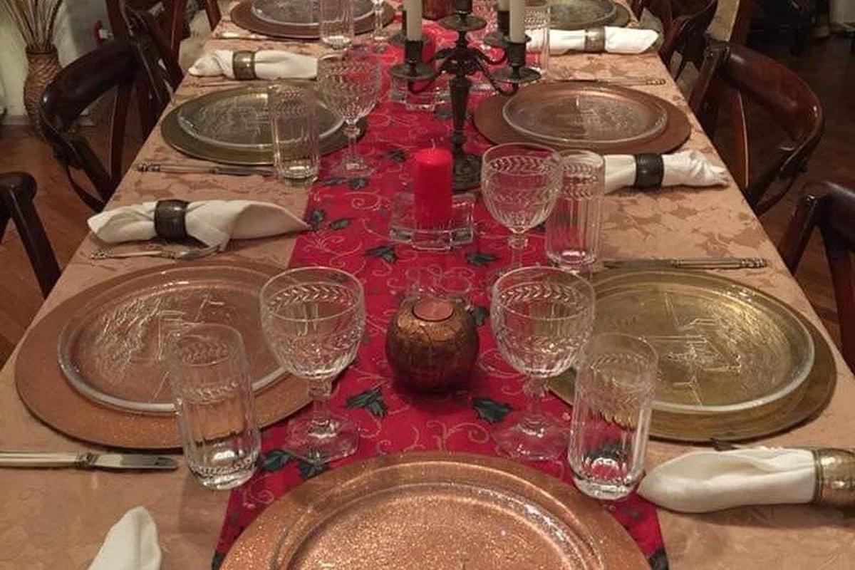 a long table with plates and glasses on it