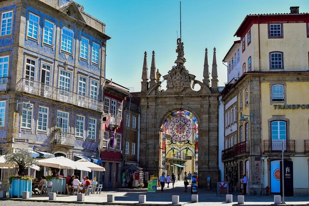 an old building with an arch in a city